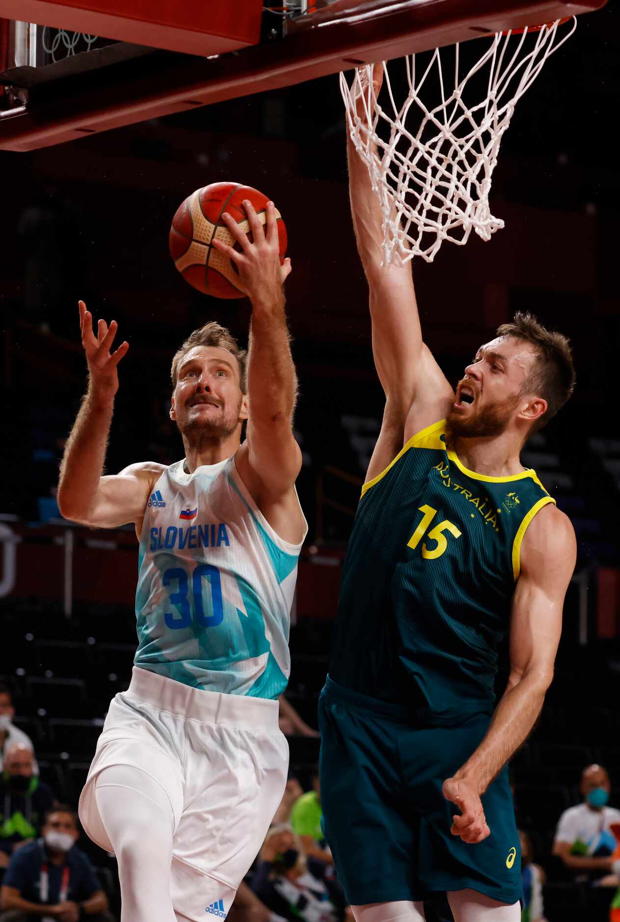 Slovenia’s Zoran Dragic (30) attempts a layup in front of Australia’s Nic Kay (15) during...