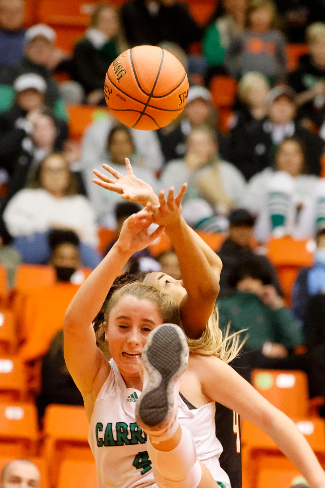 Southlake Carroll’s Olivia Knight (4) fights for the ball with South Grand Prairie’s Joy...