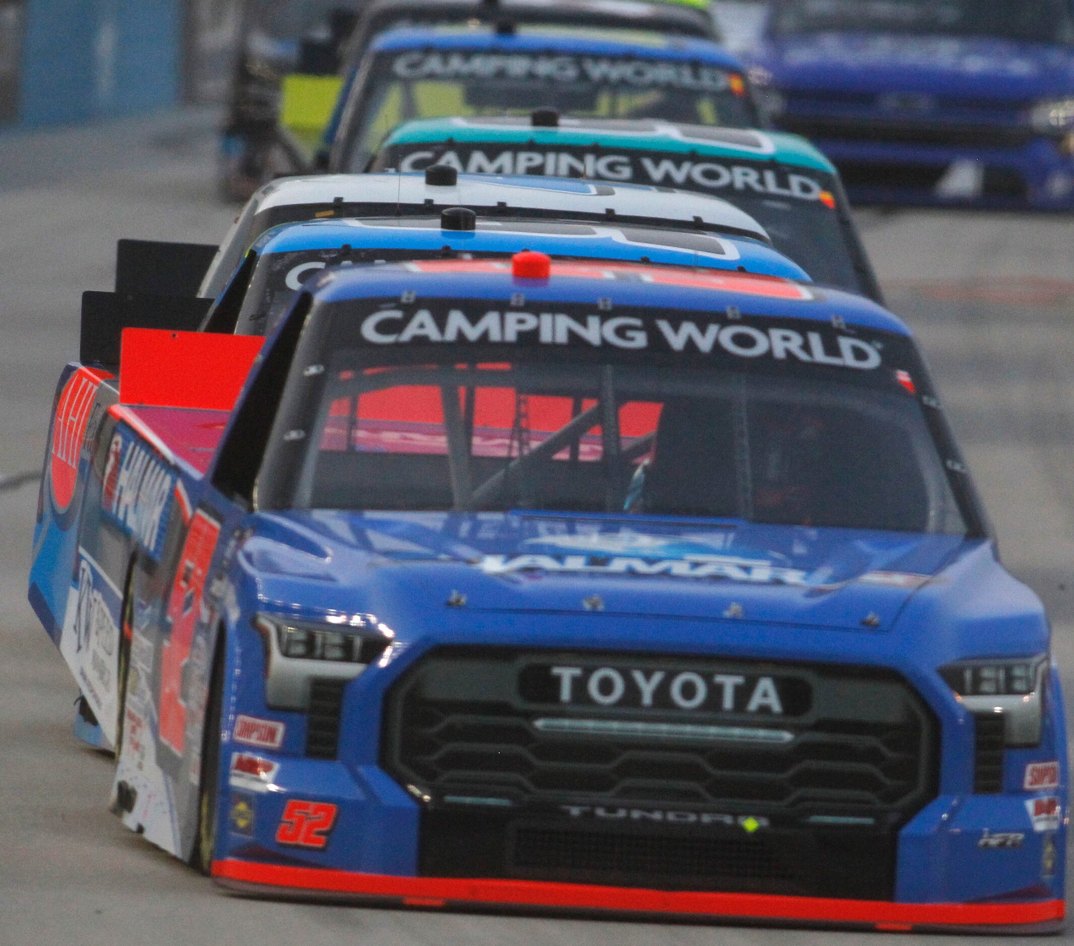 Race drivers follow the leader as Stewart Friesen (#52) in the Halmar International Toyota...