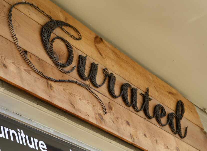 Curated, a new shop on McKinney Ave., photographed June 24, 2013. The lettering on the sign...