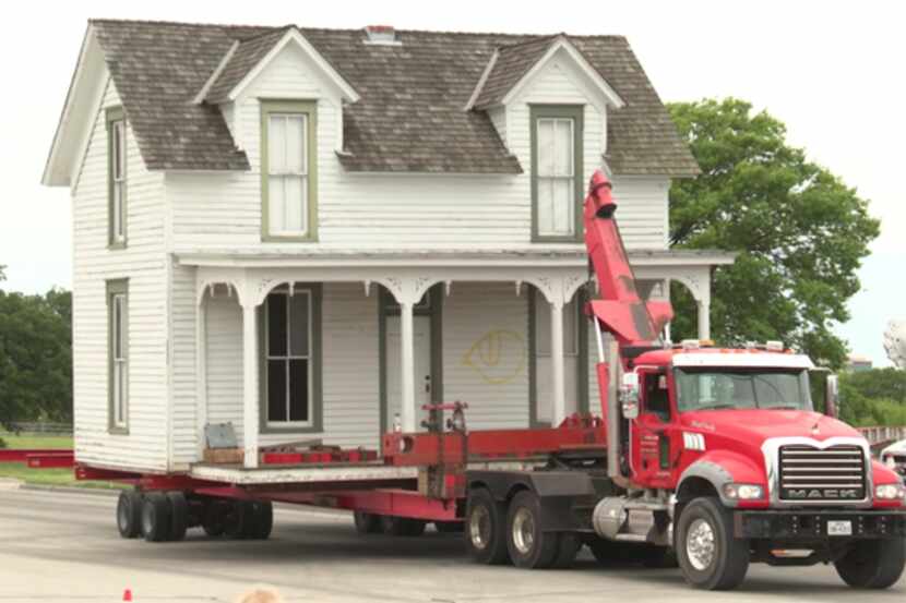 Crews carefully move the historic Miss Belle's Place down Lookout Drive in Richardson.