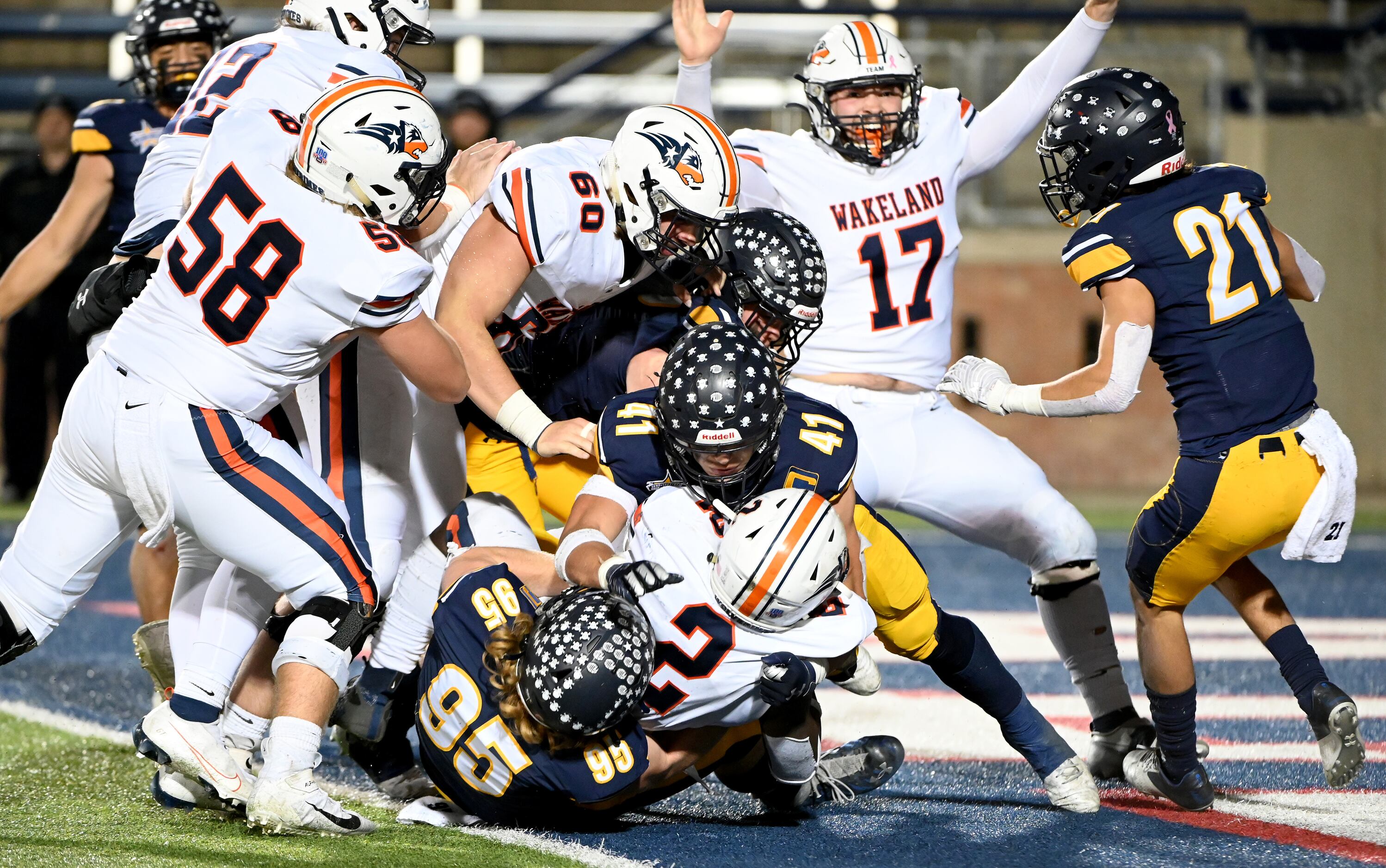 Wakeland's Jared White (2) scores the game-winning two point conversion in the final minute...