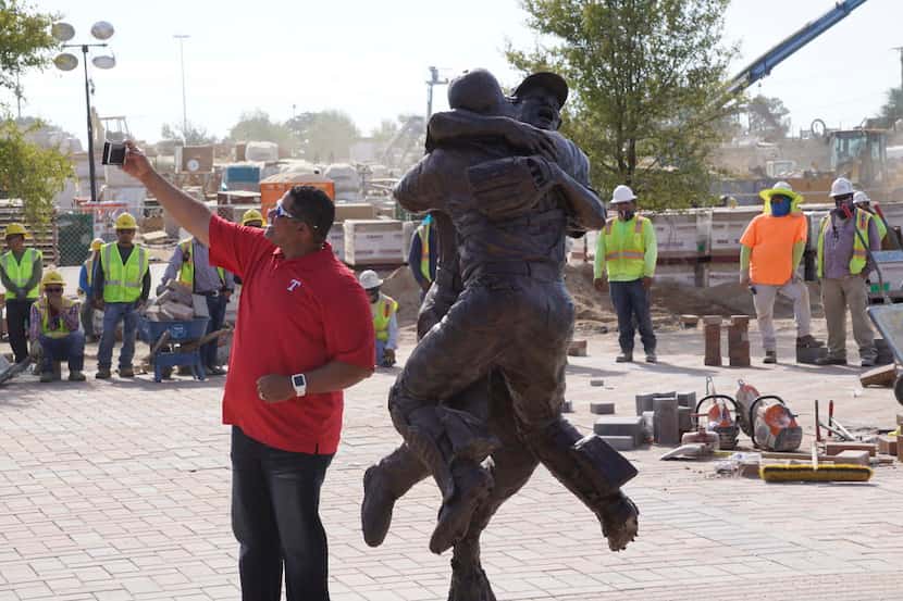 Former Texas Ranger Bengie Molina takes a selfie in front of a statue "Going To The Show"...