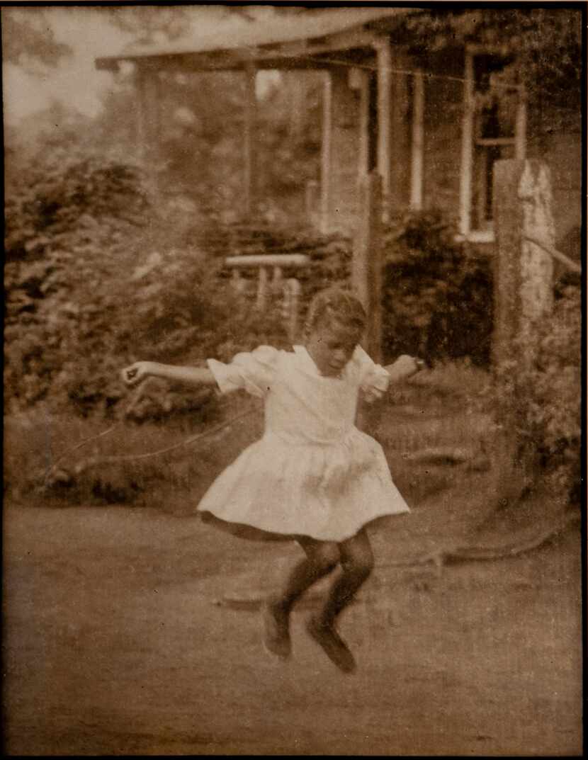 "Jumping Rope on Greenwood" by Gaylord Oscar Herron. The 1967 gelatin silver print is part...