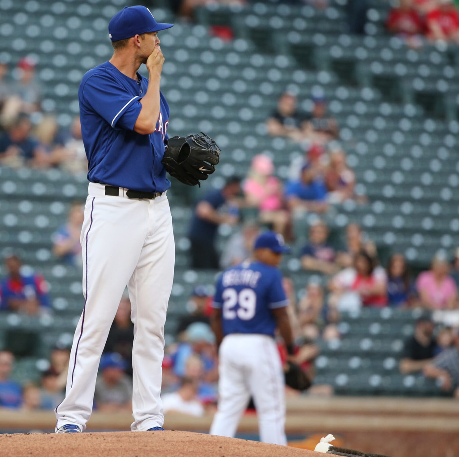 Texas Rangers starting pitcher Mike Minor (36) reacts to a home run hit by Detroit Tigers...