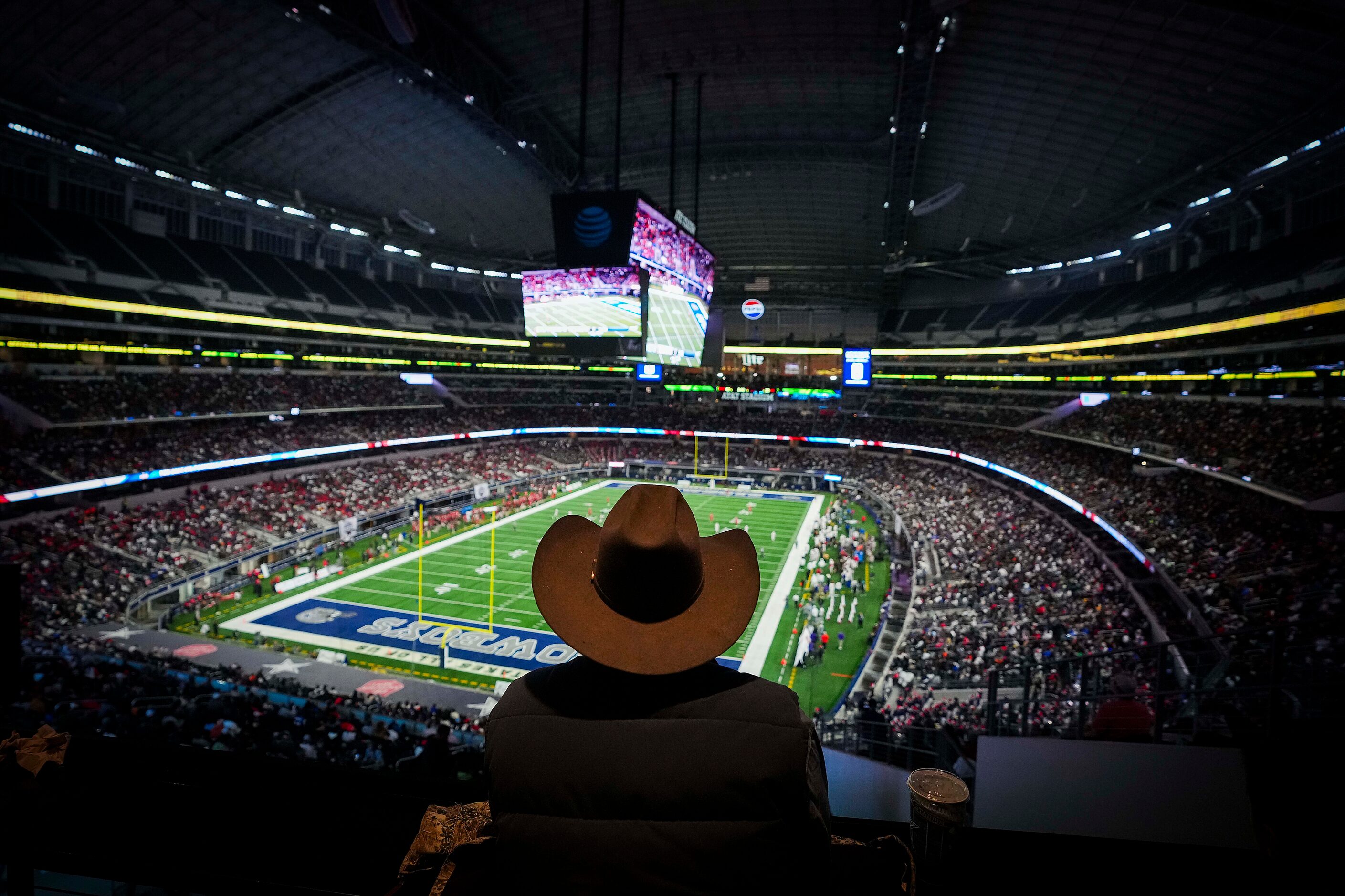 Fans watch during the second half of the Class 6A Division I state championship game between...