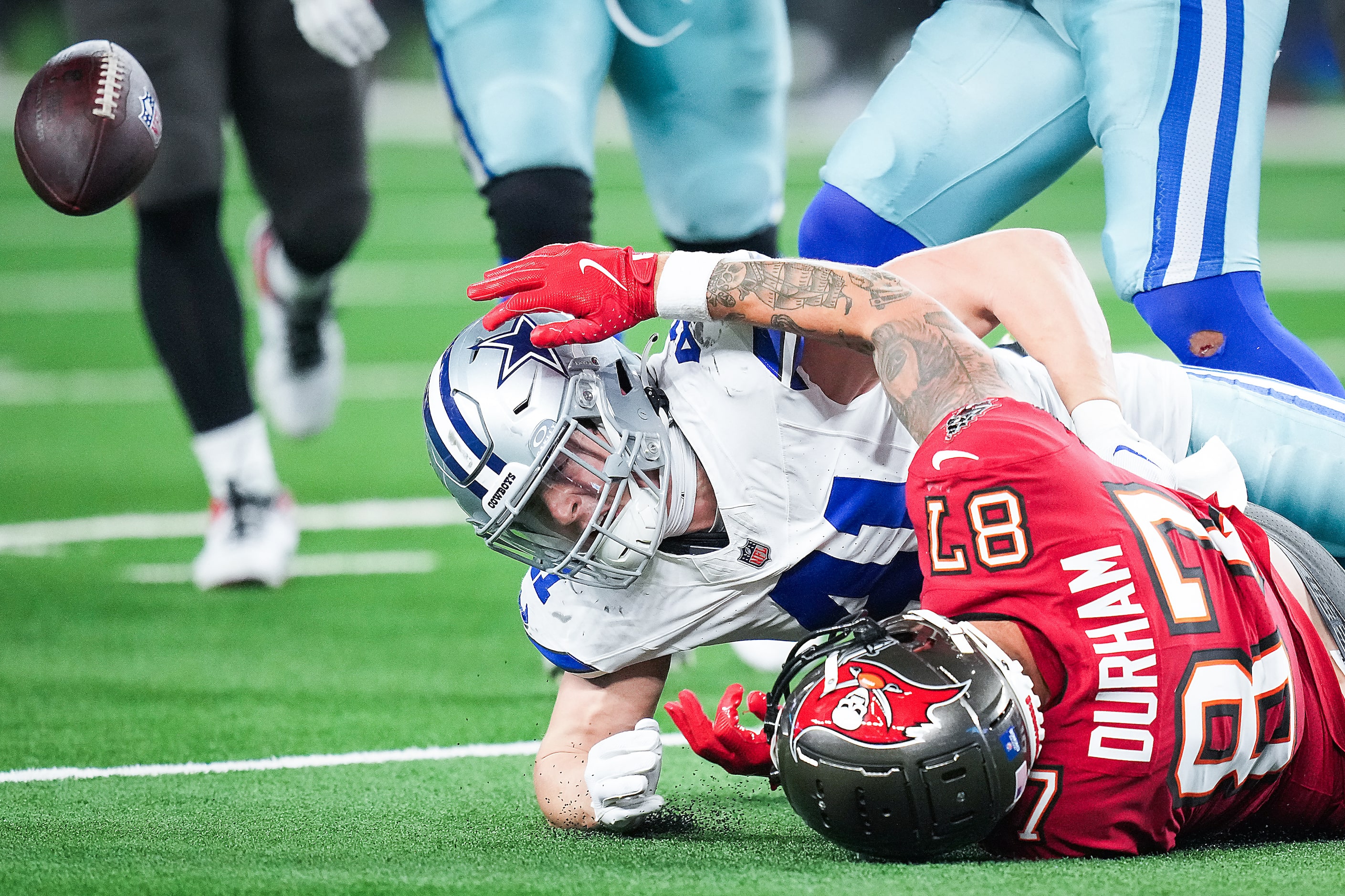 Tampa Bay Buccaneers tight end Payne Durham (87) fumbles the ball out of bounds as he is...