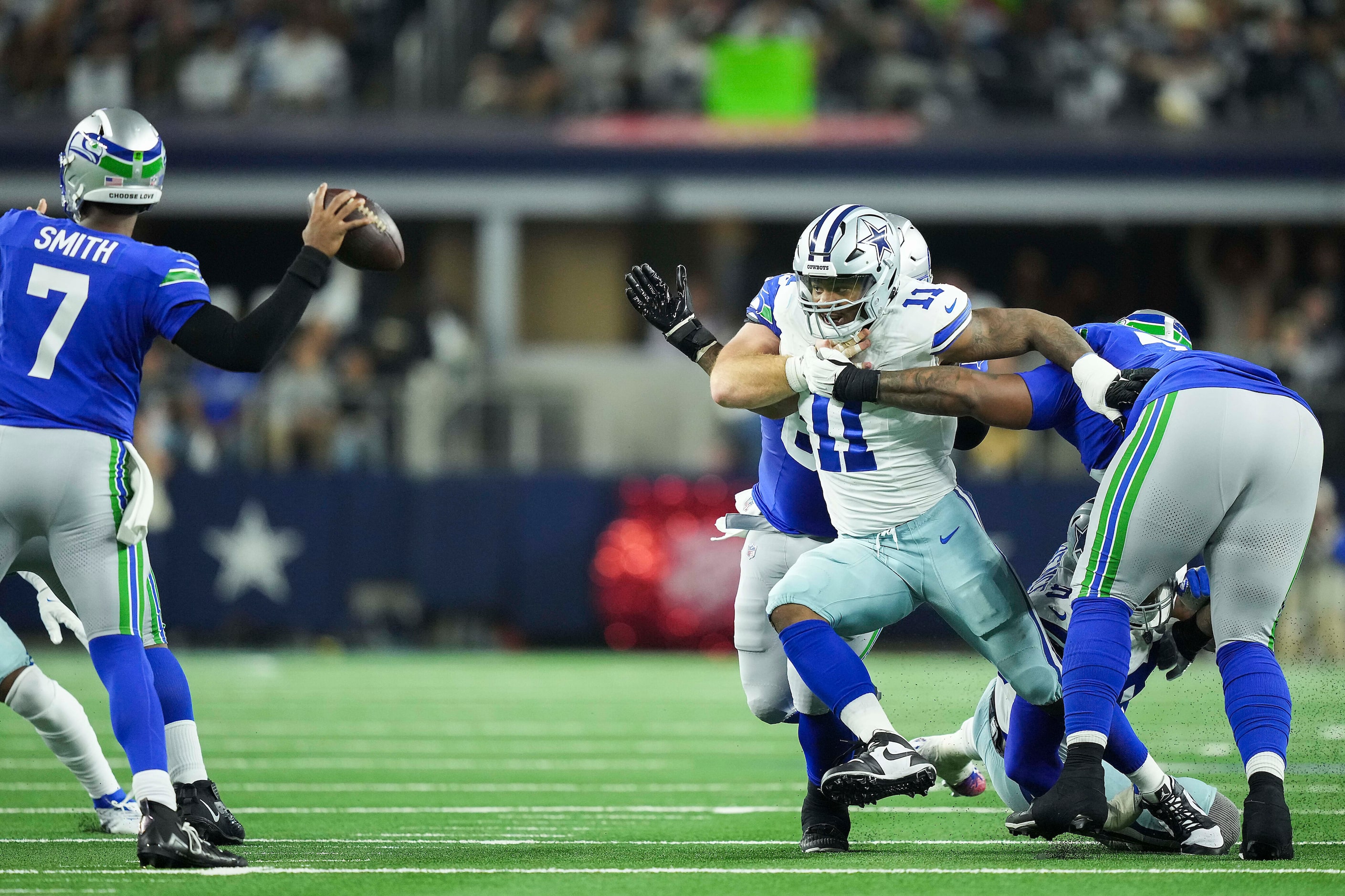 Dallas Cowboys linebacker Micah Parsons (11) tries to get through a double team from Seattle...