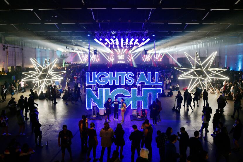 Signage at 'Lights All Night' illuminates Dallas Market Hall on Friday, Dec. 28, 2018.