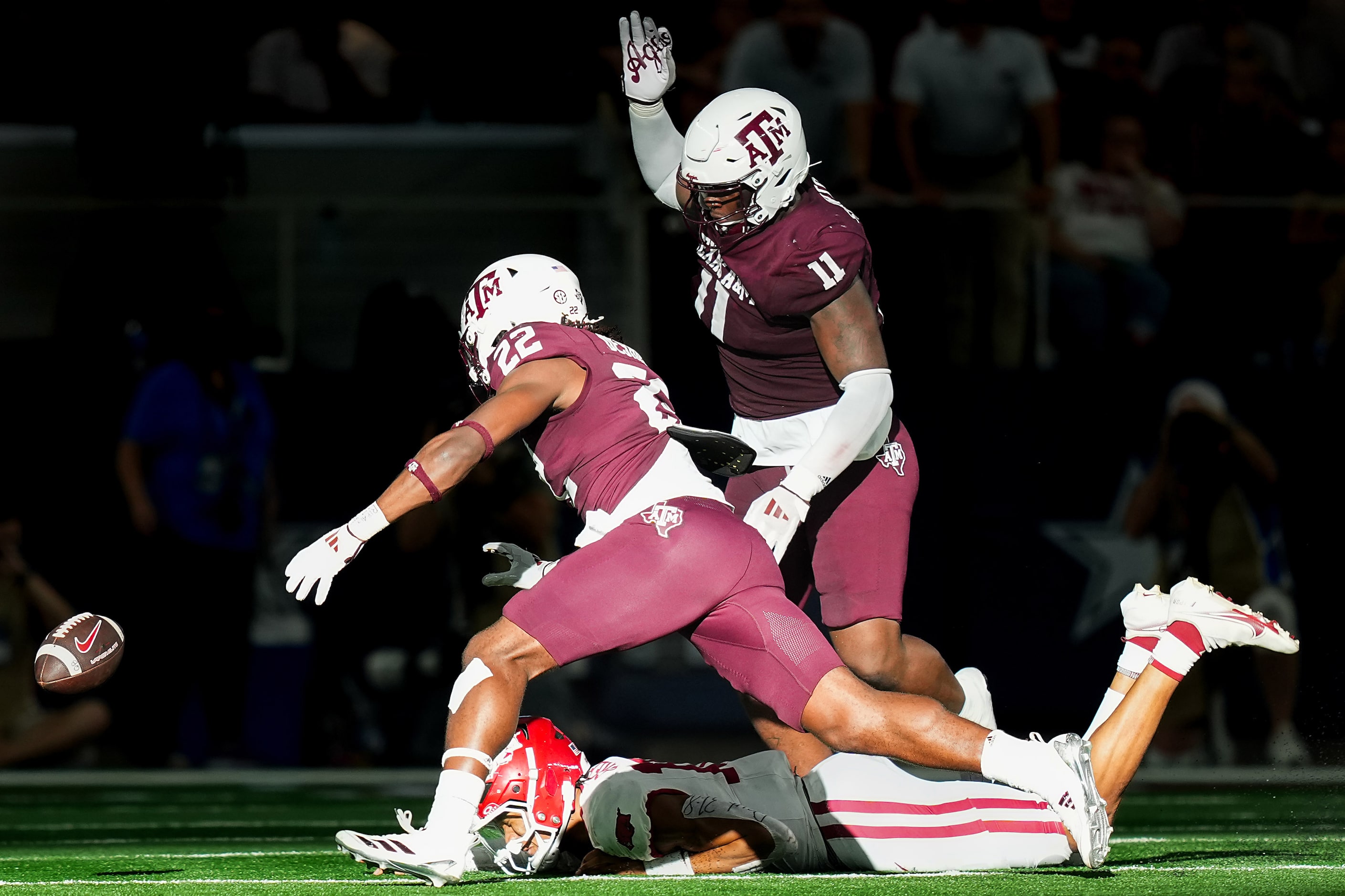 Arkansas quarterback Taylen Green (10) turns the ball over with a fumble as Texas A&M...