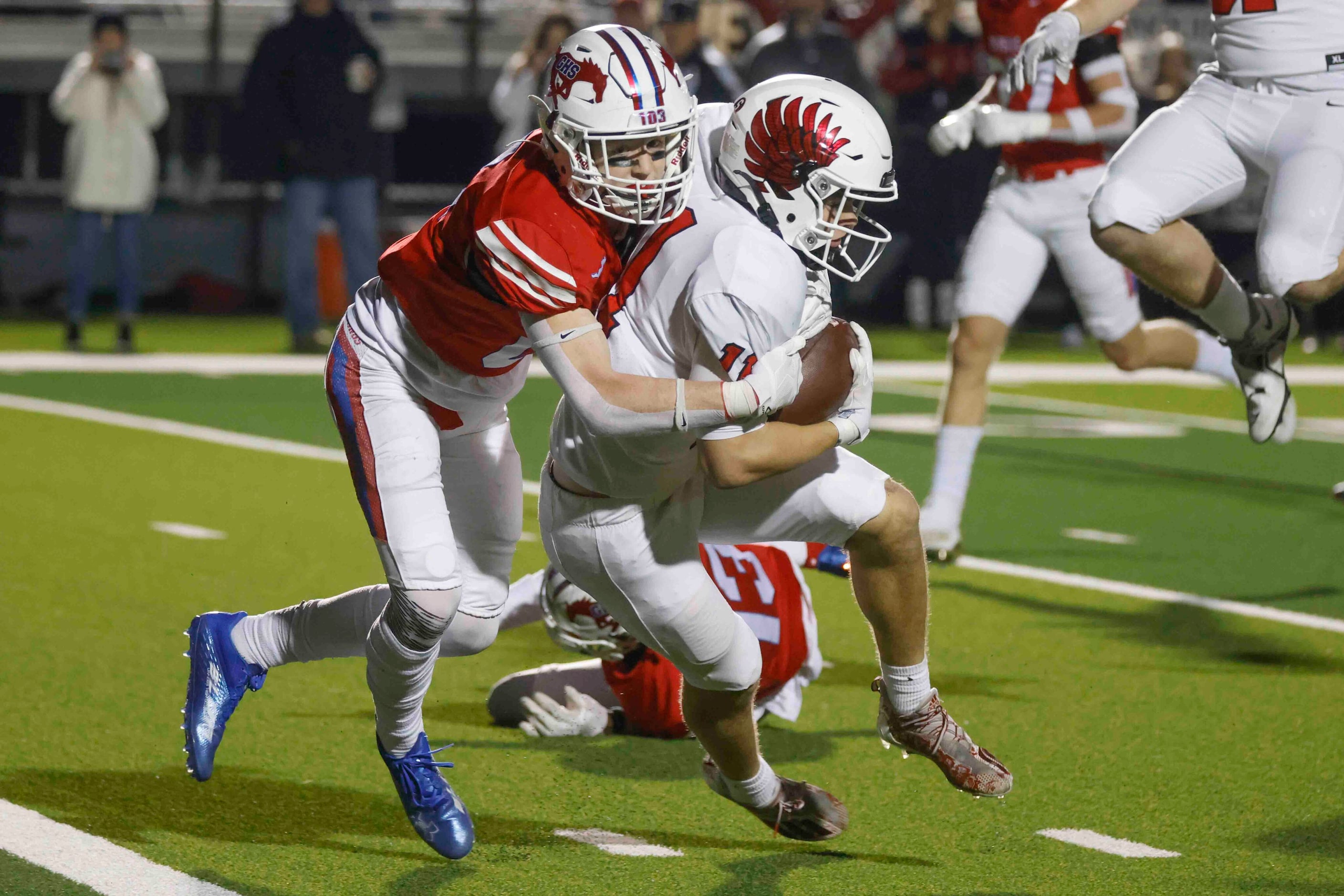 Grapevine High’s Major Heckt (6), left, tackles Argyle High’s RJ Bunnell (11) as he...