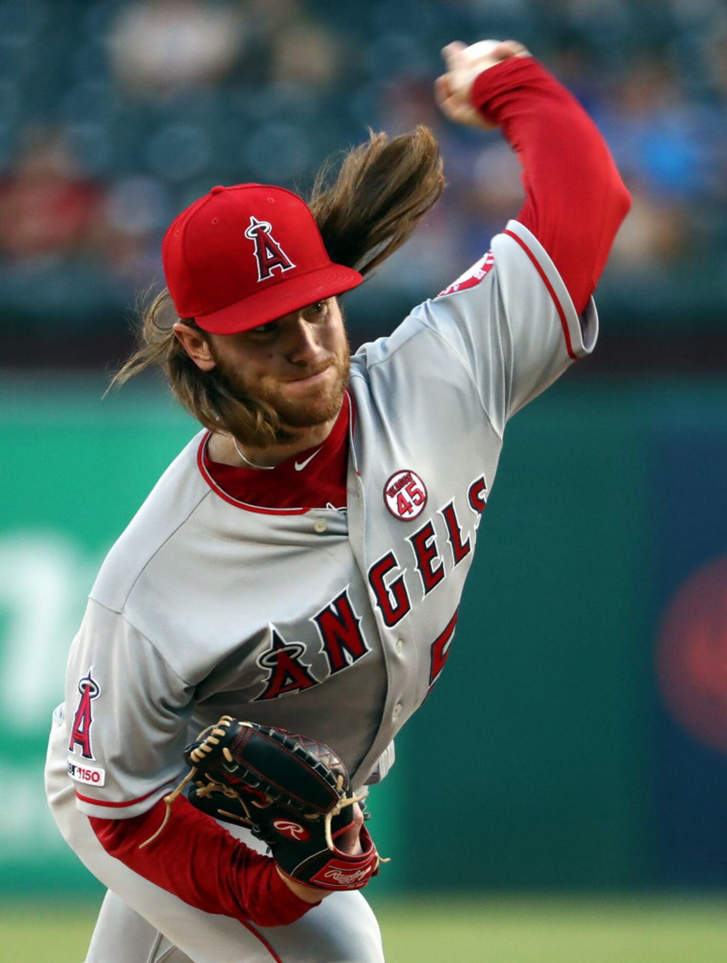 ARLINGTON, TEXAS - AUGUST 19:  Dillon Peters #52 of the Los Angeles Angels throws against...