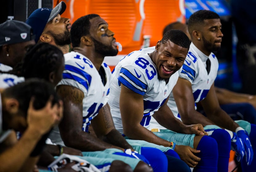 Dallas Cowboys wide receiver Terrance Williams (83) jokes on the sidelines during the third...