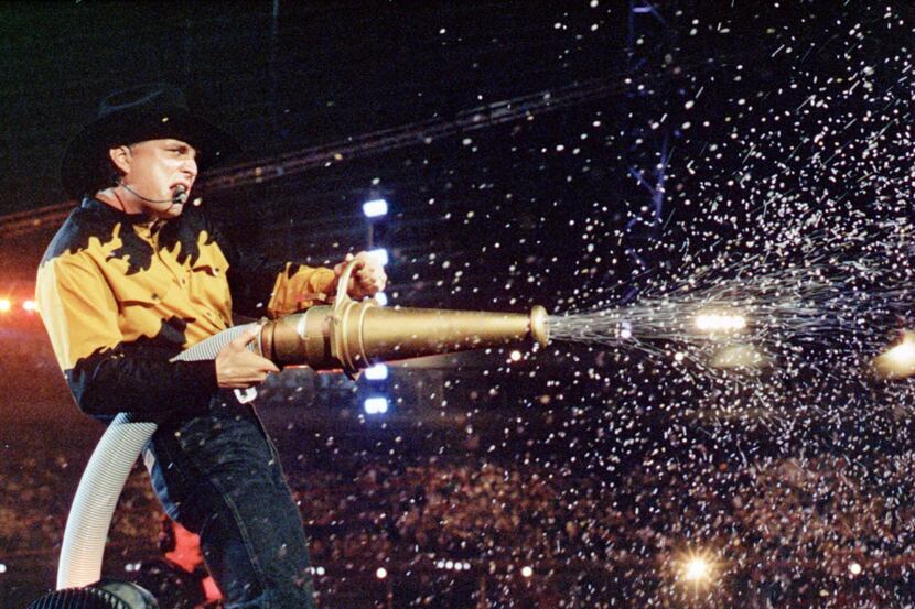 Garth Brooks shooting confetti at Texas Stadium in 1993