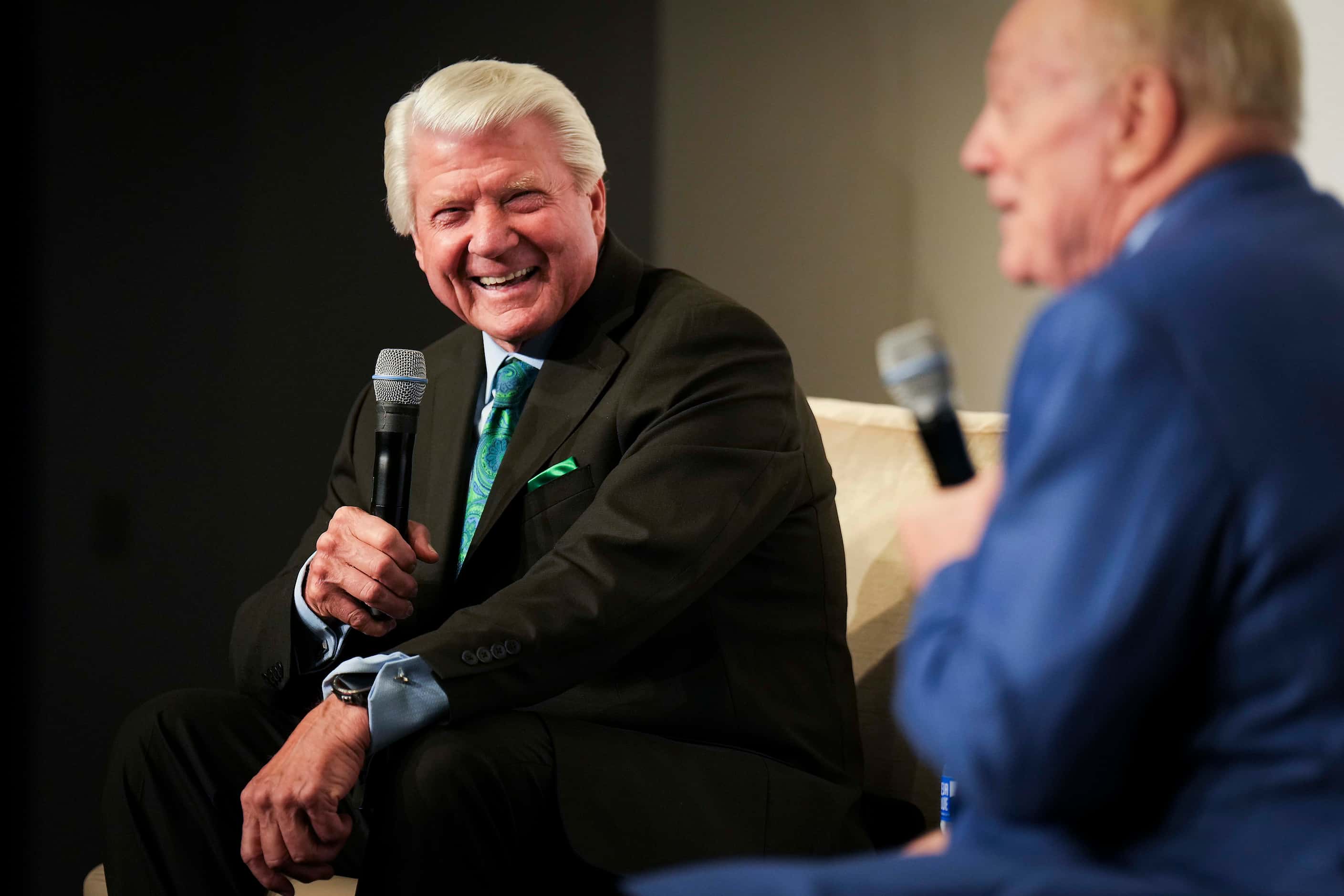 Former Dallas Cowboys coach Jimmy Johnson (left) laughs with Cowboys owner and general...