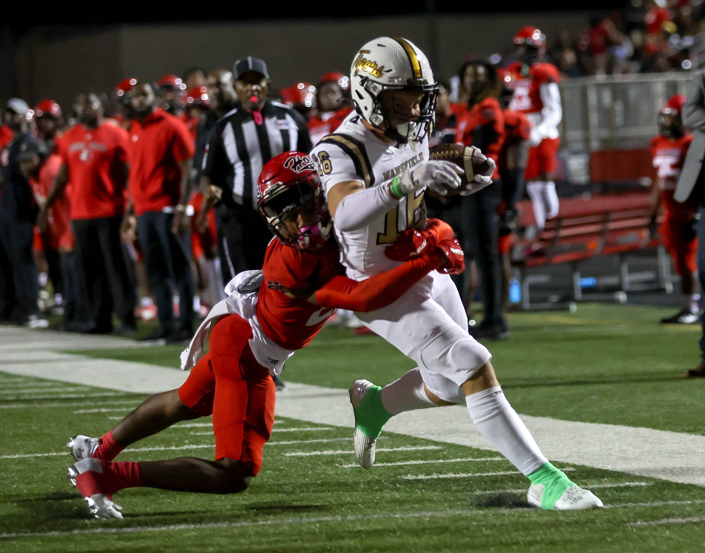 Mansfield wide receiver Lincoln Ellington (16) fights his way to the goalline against Cedar...