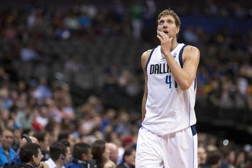 Oct 14, 2013; Dallas, TX, USA; Dallas Mavericks power forward Dirk Nowitzki (41) comes off...