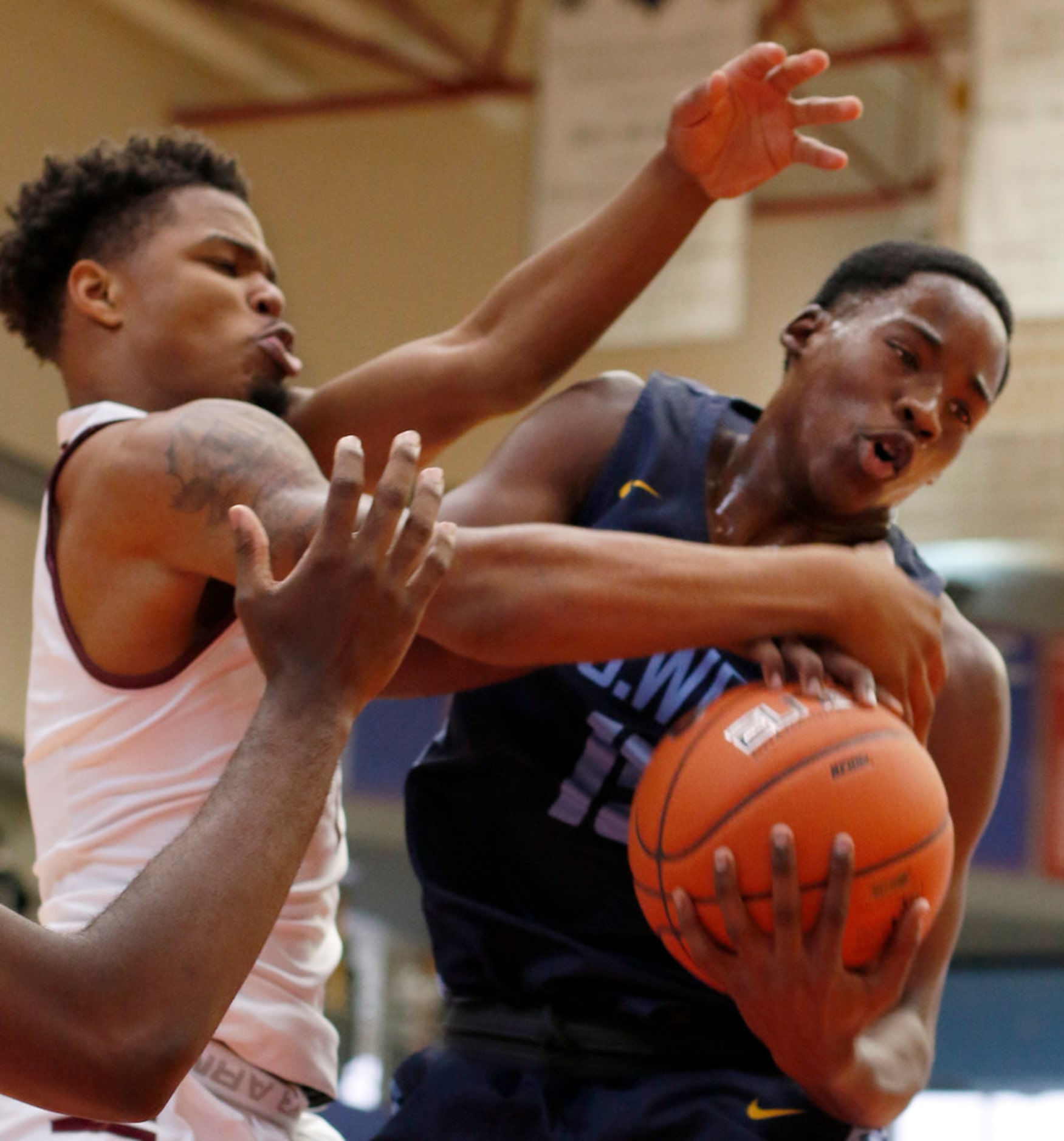 Mansfield Timberview senior Ahmad Richardson (11), left, battles with Putnam City West,...