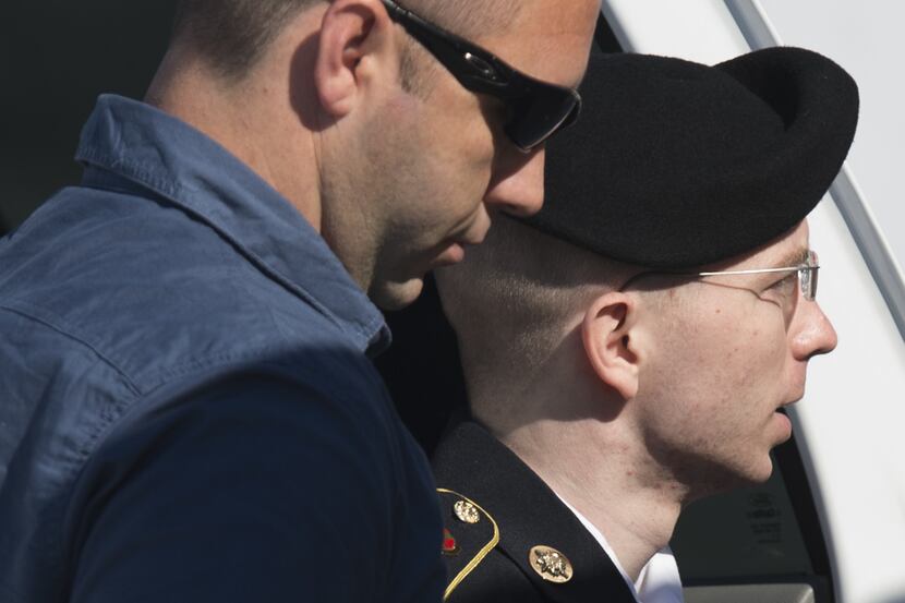 US Army Private First Class Bradley Manning arrives alongside a military official at a US...