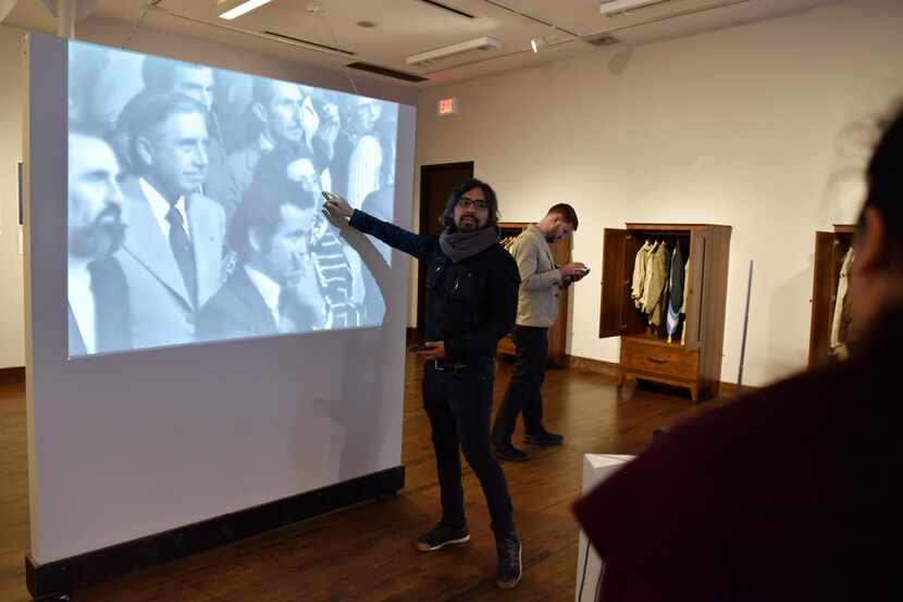 Peruvian artist Rudolph Castro speaks about a video projected on a wall at his exhibition at...