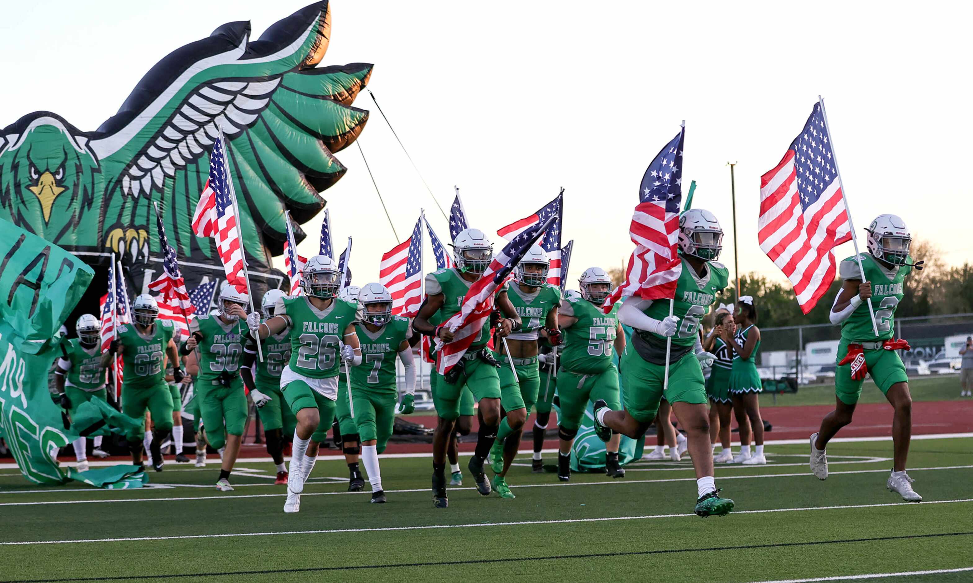 The Lake Dallas Falcons enter the field to face Frisco Memorial in a District 3-5A Division...