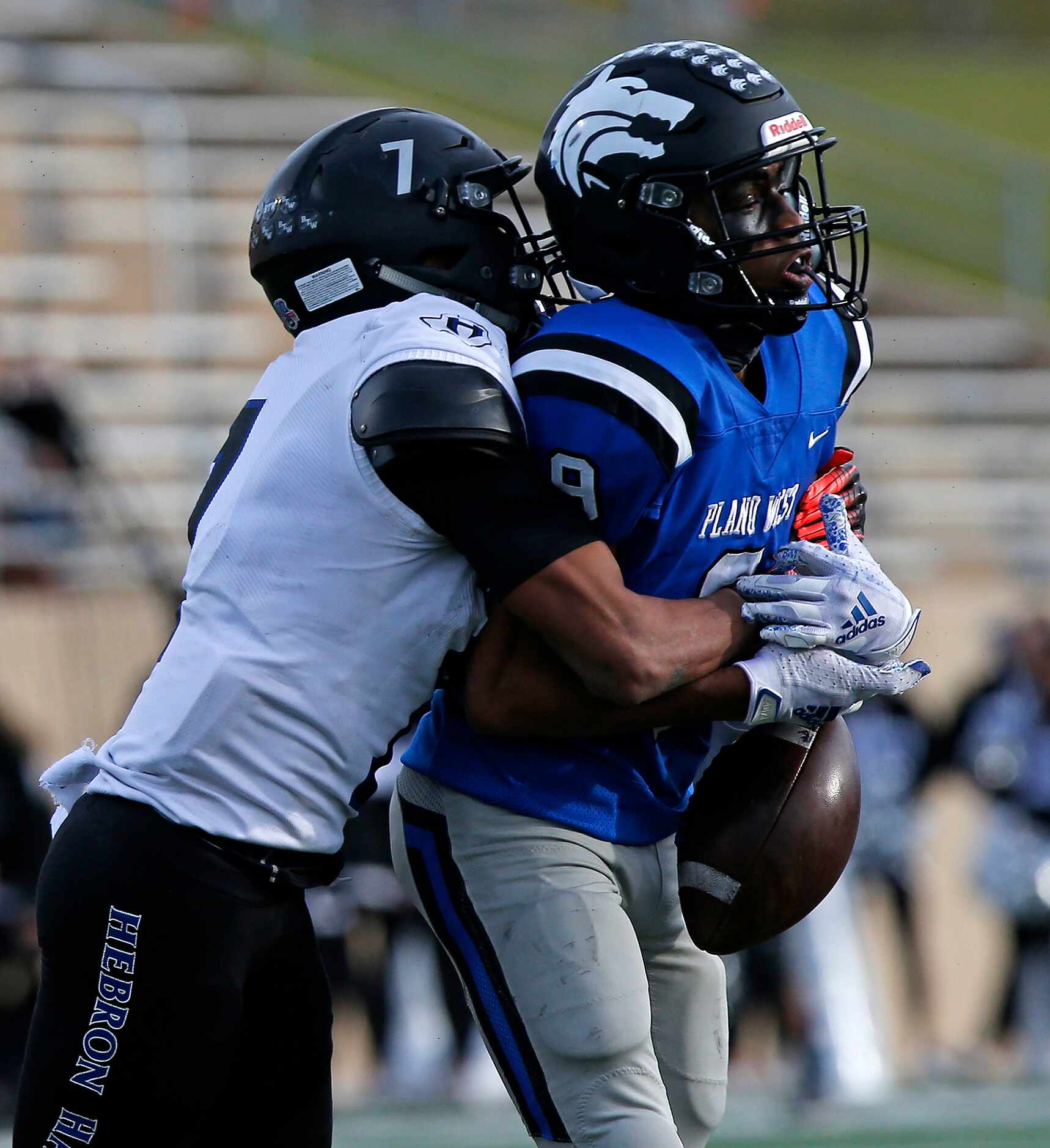 Hebron High School defensive back Trenton Bronaugh (7) breaks up a pass intended for Plano...