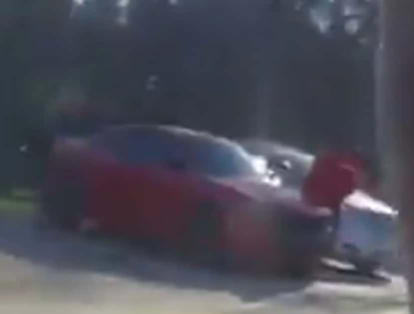 Investigators said the car, believed to be a red Dodge Charger, was seen near the scene of...