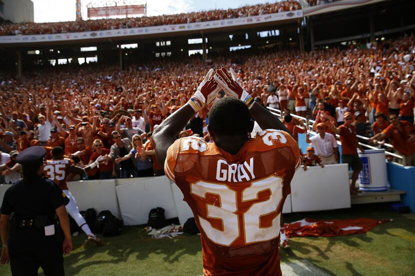 Texas Longhorns running back Johnathan Gray (32) celebrates with fans after beating the...