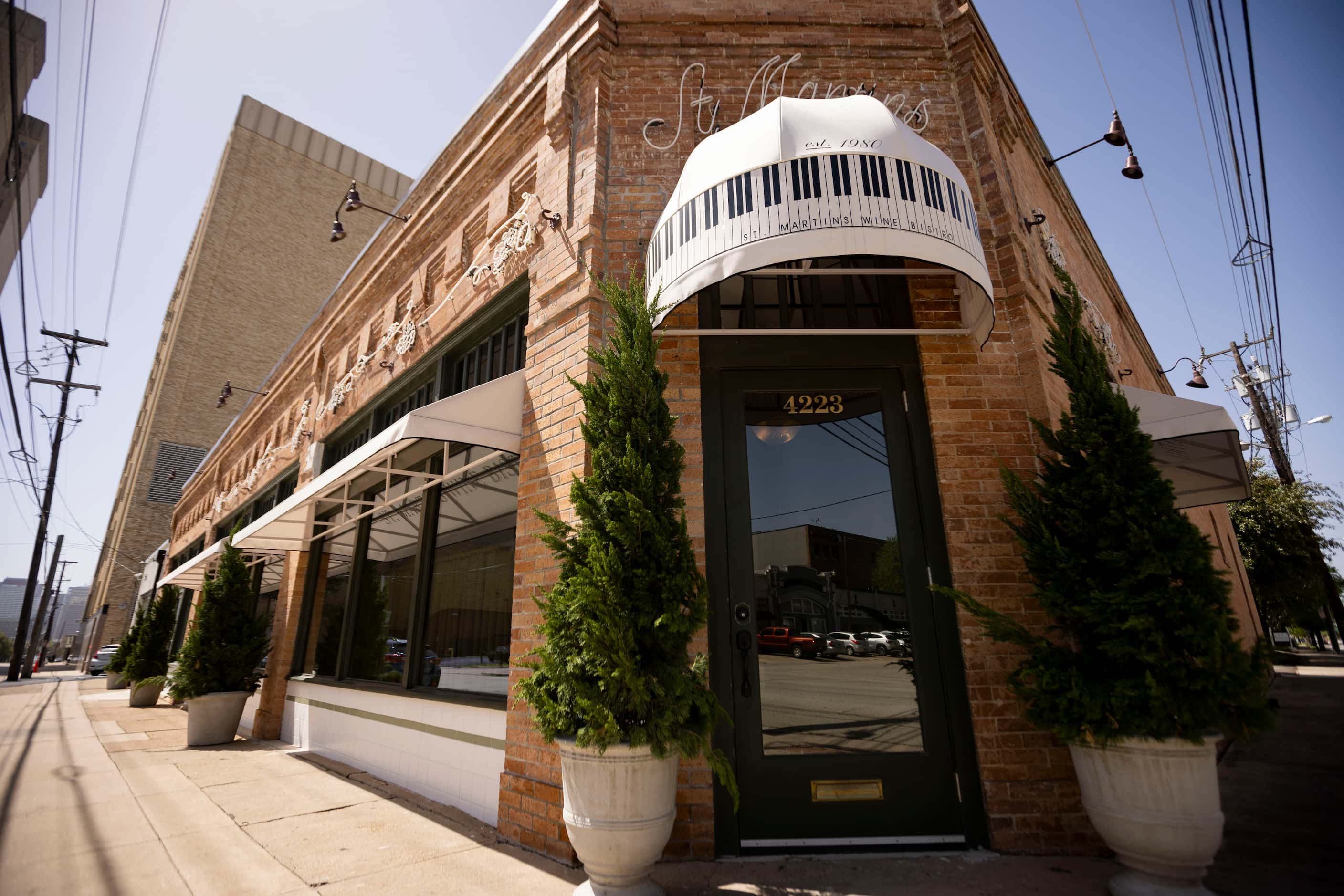 Customers enter St. Martin's Wine Bistro on the corner. You can't miss the piano-key awning.