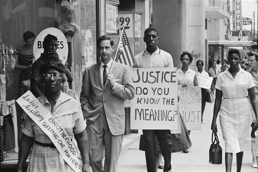 People picket a department store in Charlotte, N.C., in 1960. This photograph is part of a...