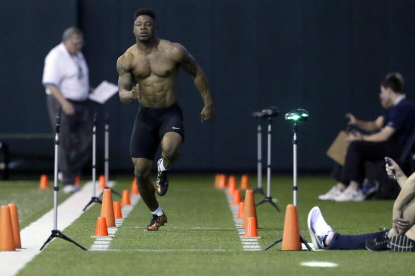 Wide receiver Corey Coleman runs for NFL scouts during a Pro Day college football workout at...