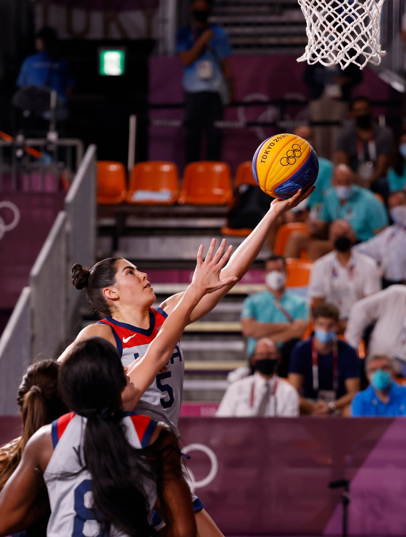 USA’s Kelsey Plum (5) attempts a layup in front of ROC’s Yulia Kozik (1) during the 3x3...