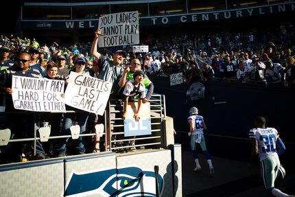 Fans taunt Dallas Cowboys players, including tight end Blake Jarwin (89) and cornerback...