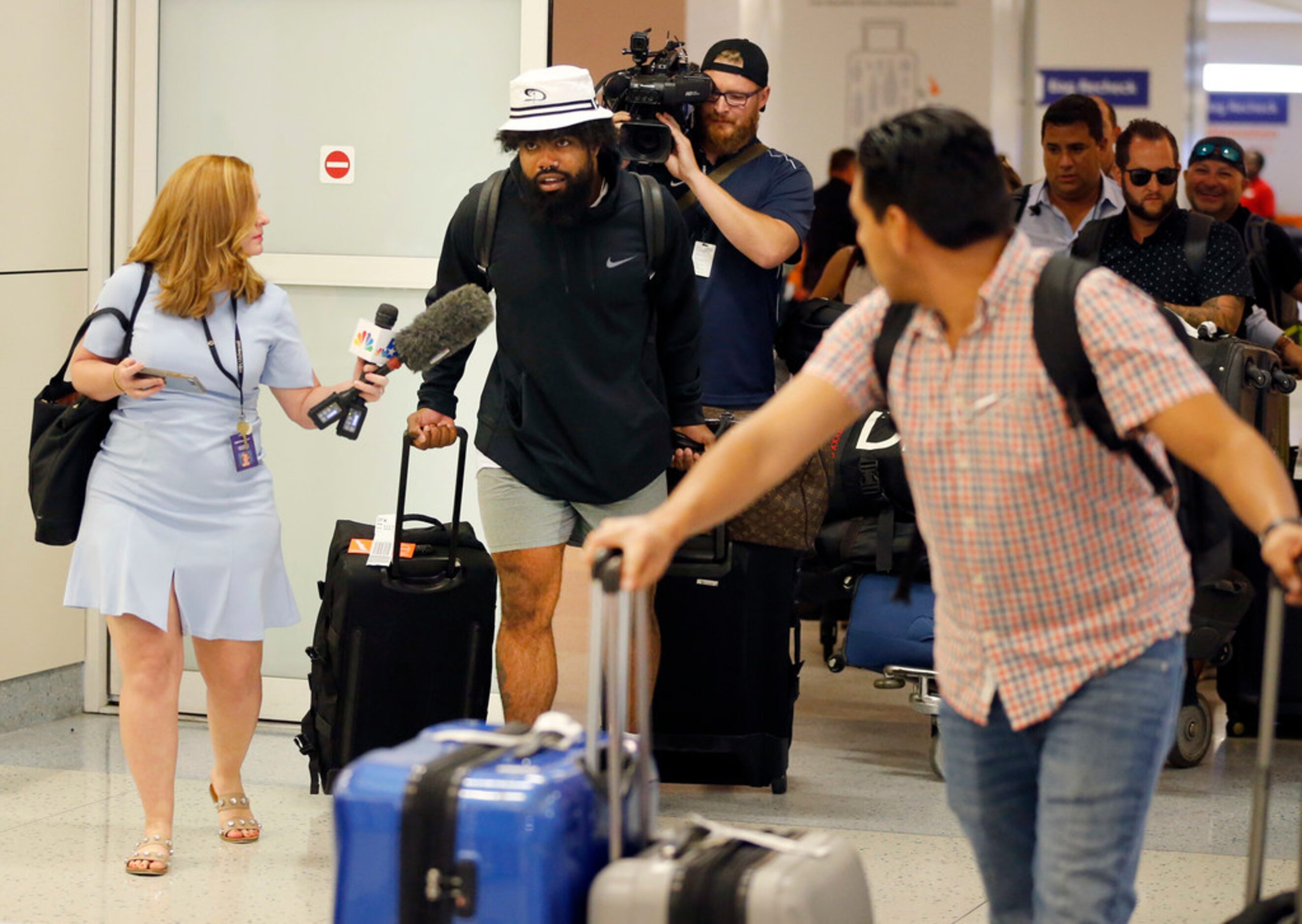 Dallas Cowboys running back Ezekiel Elliott arrives through customs at Dallas Fort Worth...