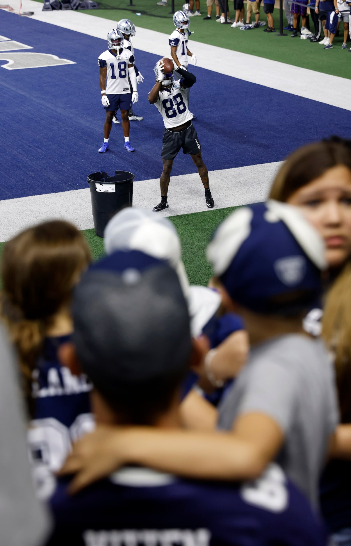 Dallas Cowboys fans watch as newly signed  wide receiver CeeDee Lamb (88) catches pass off a...