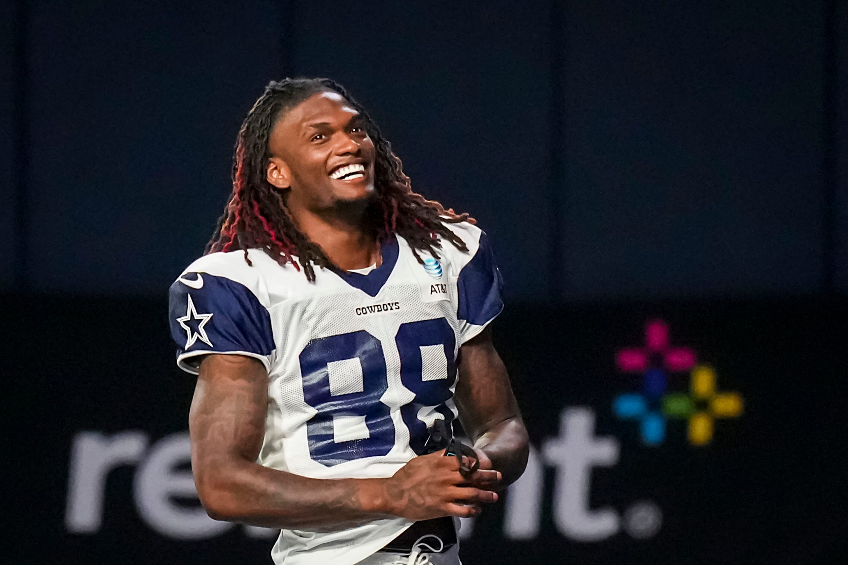 Dallas Cowboys wide receiver CeeDee Lamb laughs between drills during a training camp...