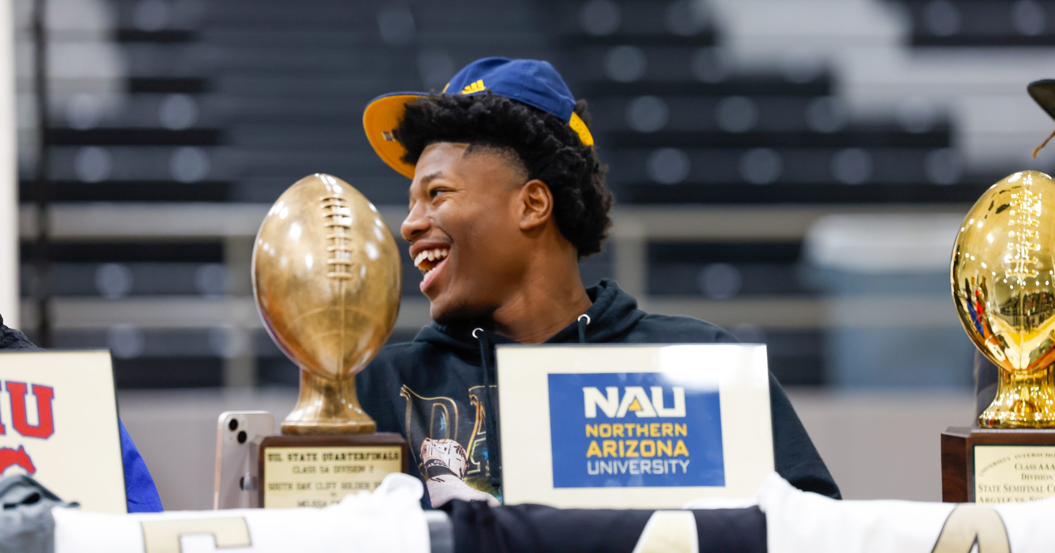 South Oak Cliff football player David Spruiells smiles as players make their entrances into...