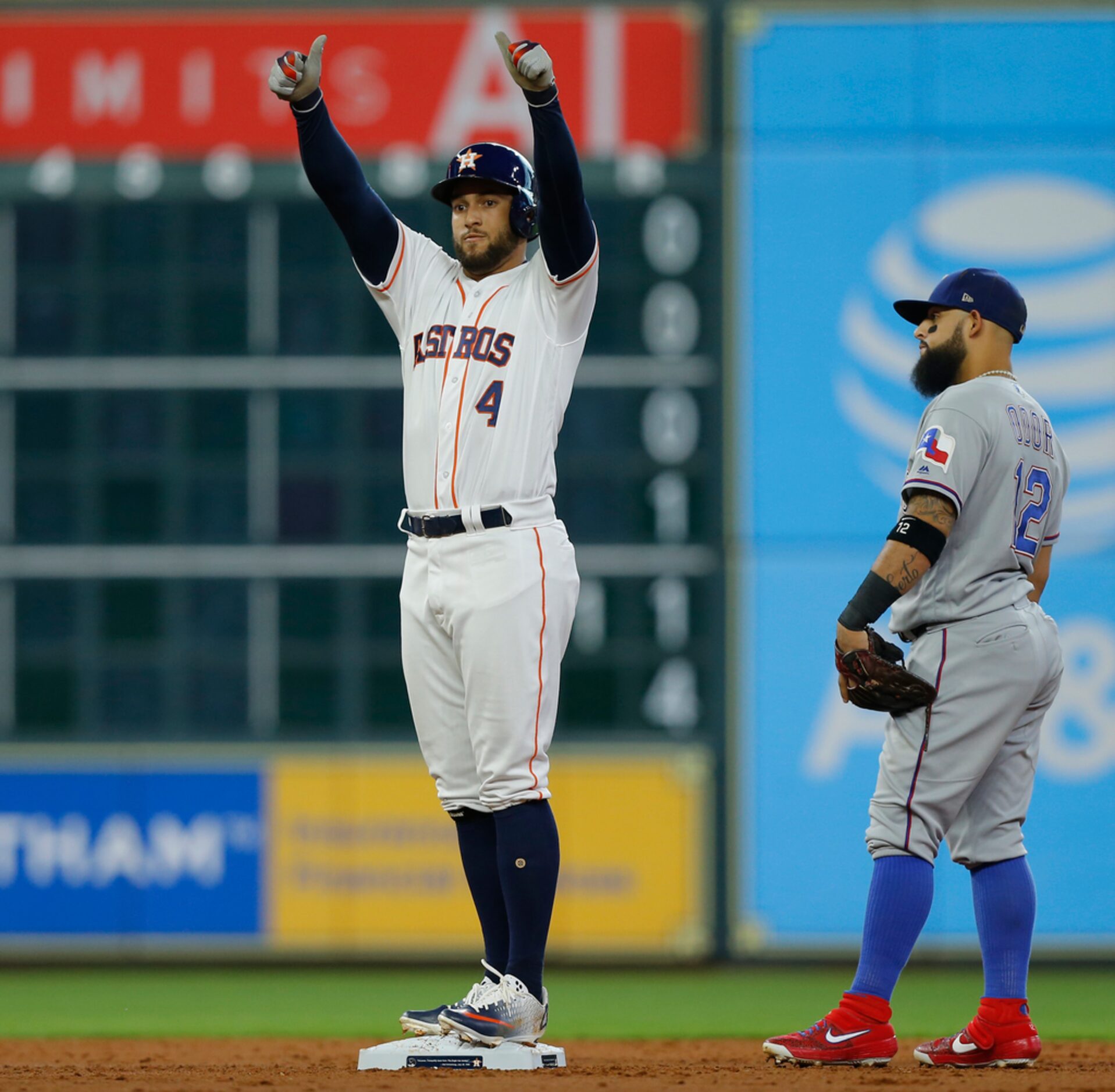 HOUSTON, TEXAS - JULY 20: George Springer #4 of the Houston Astros celebrates a RBI double...