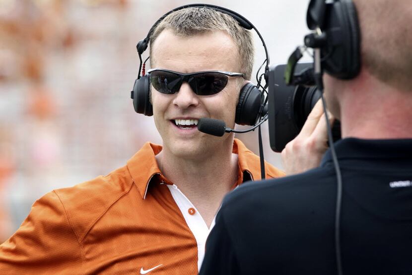 In this April 3, 2011, file photo, Texas' co-offensive coordinator Bryan Harsin gives an...