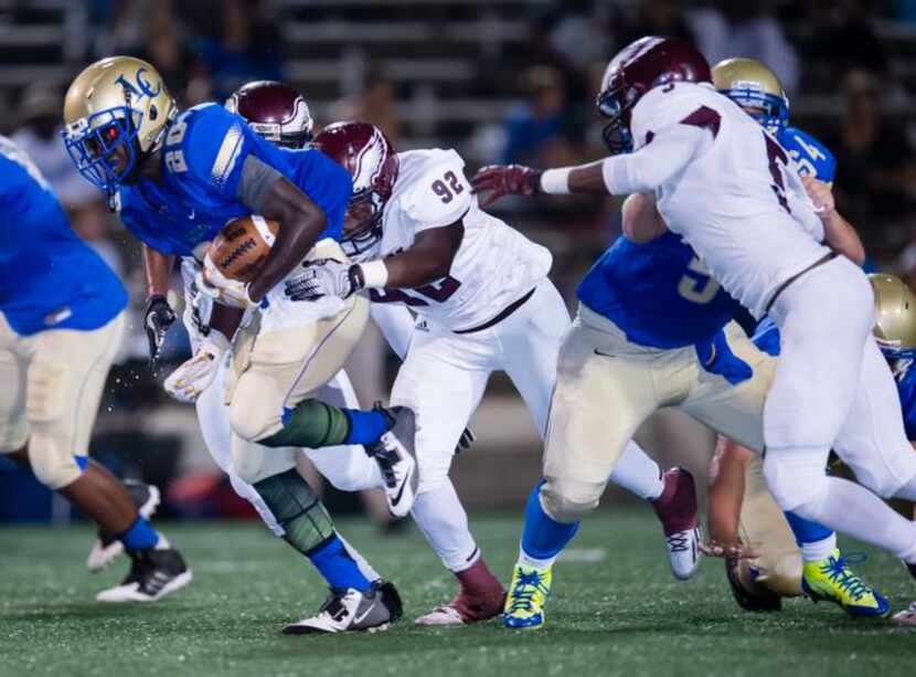 
Rowlett’s David Matthews (92) catches up to Lakeview Centennial ball carrier Jamil Linwood...