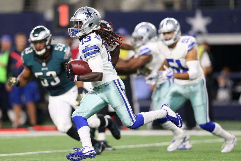 Dallas Cowboys wide receiver Lucky Whitehead (13) makes a long run on a kickoff return...