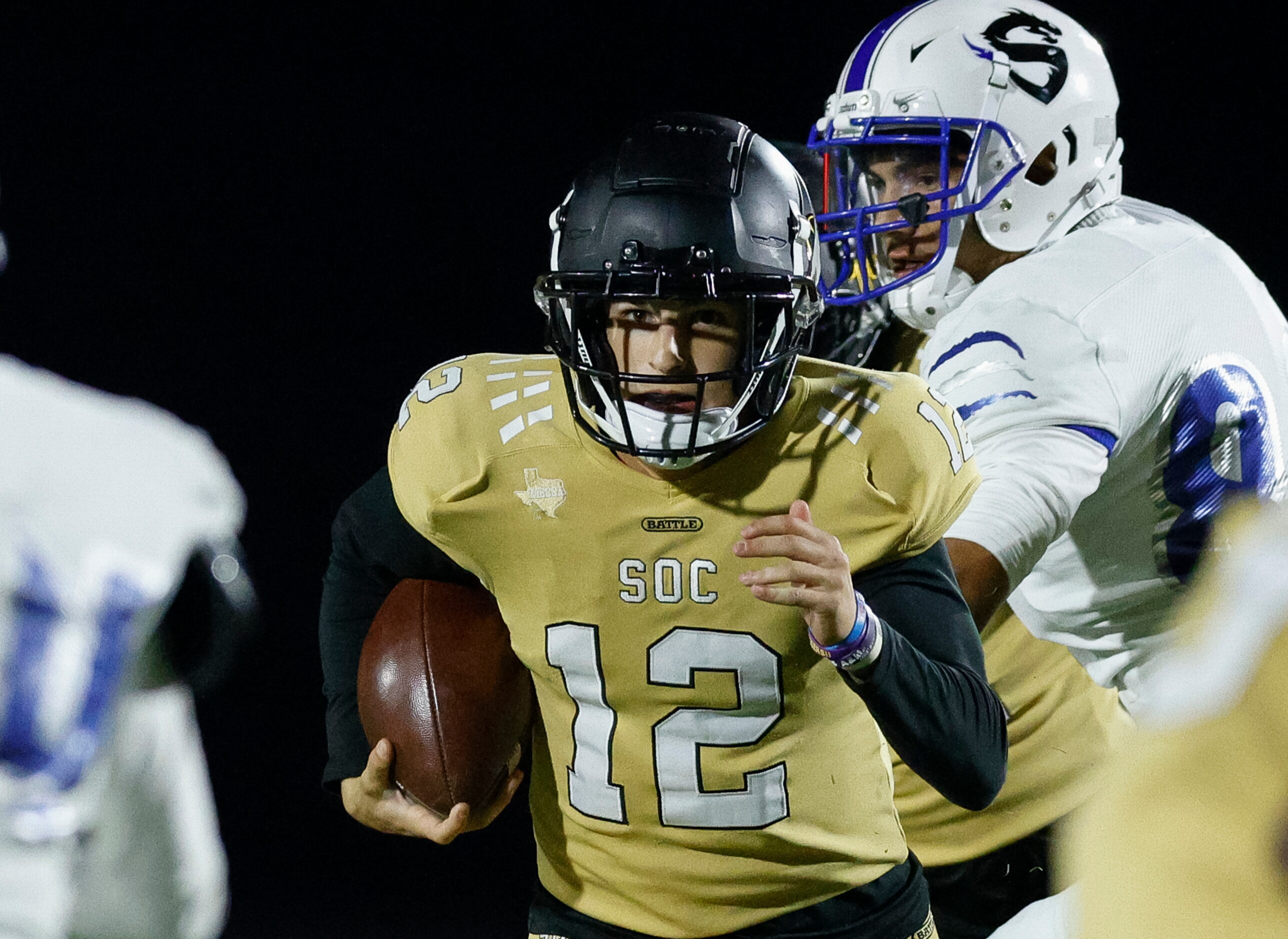 South Oak Cliff quarterback Carter Kopecky (12) runs the ball during the second half of a...