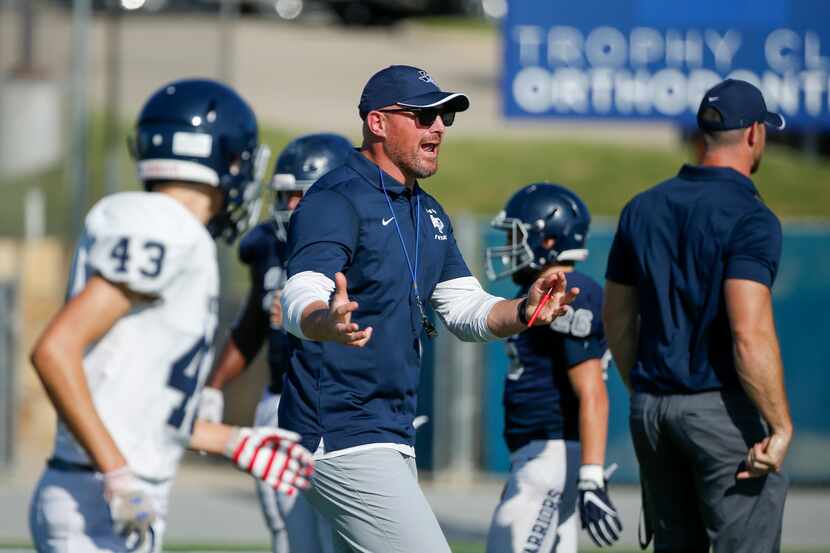 Argyle Liberty Christian head coach Jason Witten talks to players during a football practice...