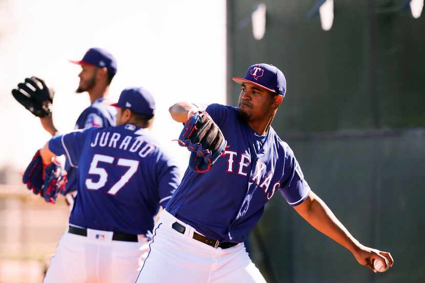 Texas Rangers pitcher Yohander Mendez throws in the bullpen during a spring training workout...