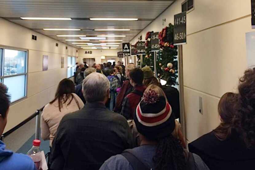 Passengers at Chicago's Midway Airport prepared Sunday to board their Southwest Airlines...