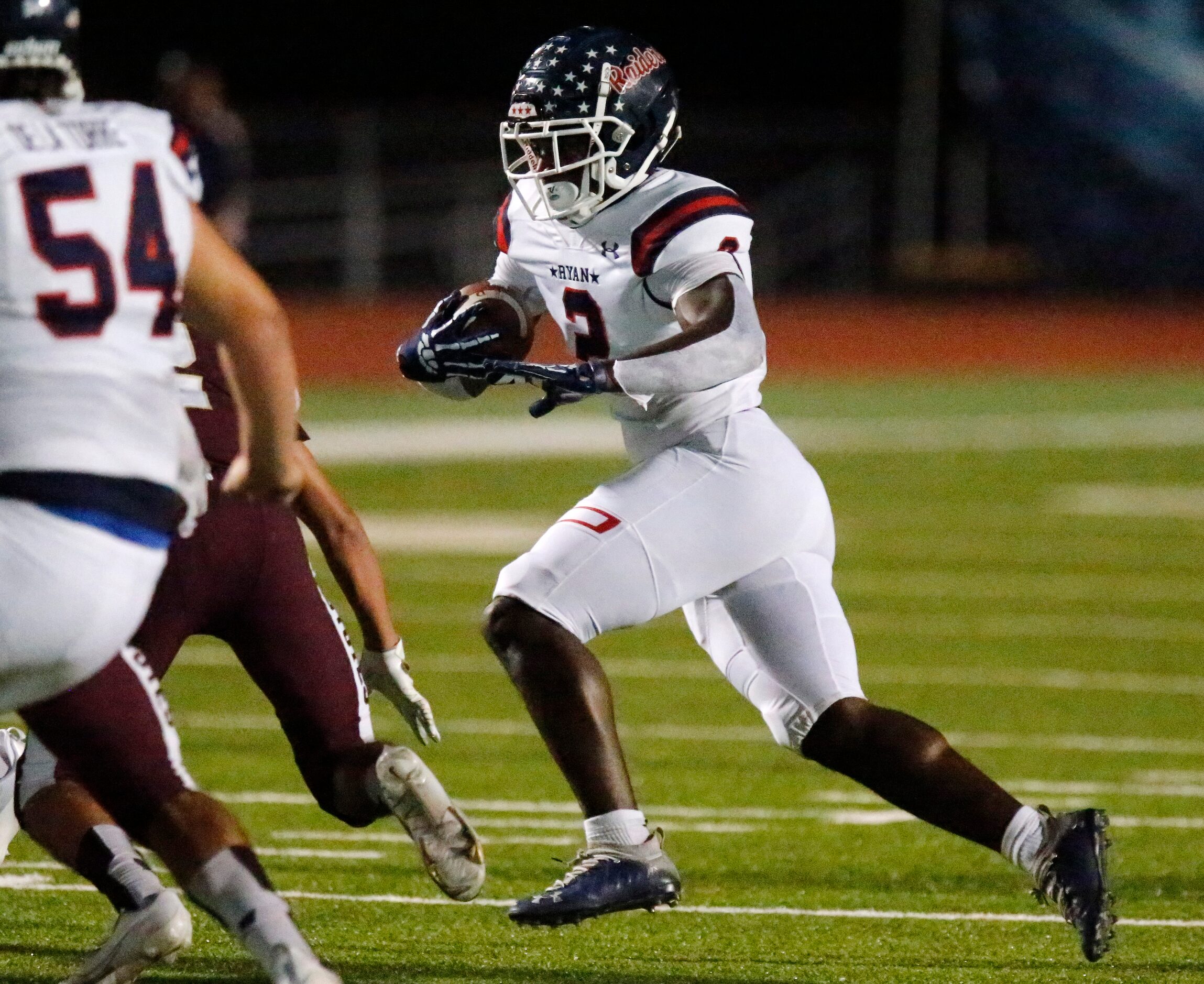 Denton Ryan High School running back Kalib Hicks (2) runs for a touchdown during the first...