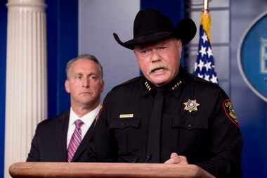 Tarrant County Sheriff Bill Waybourn of Texas (right), accompanied by Immigration and...