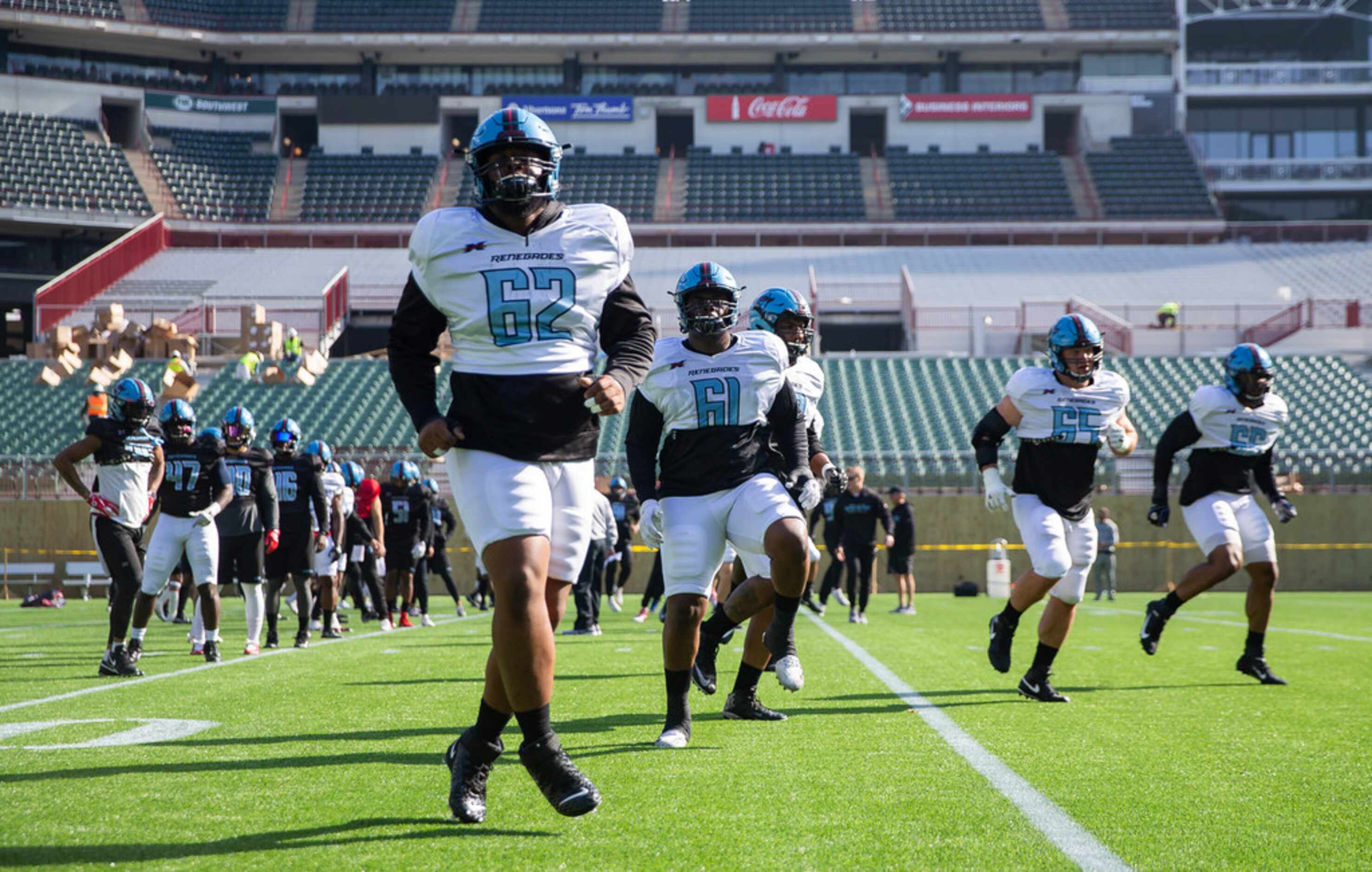 The Dallas Renegades warm-up before practice on Jan. 27, 2020 at Globe Life Park in...