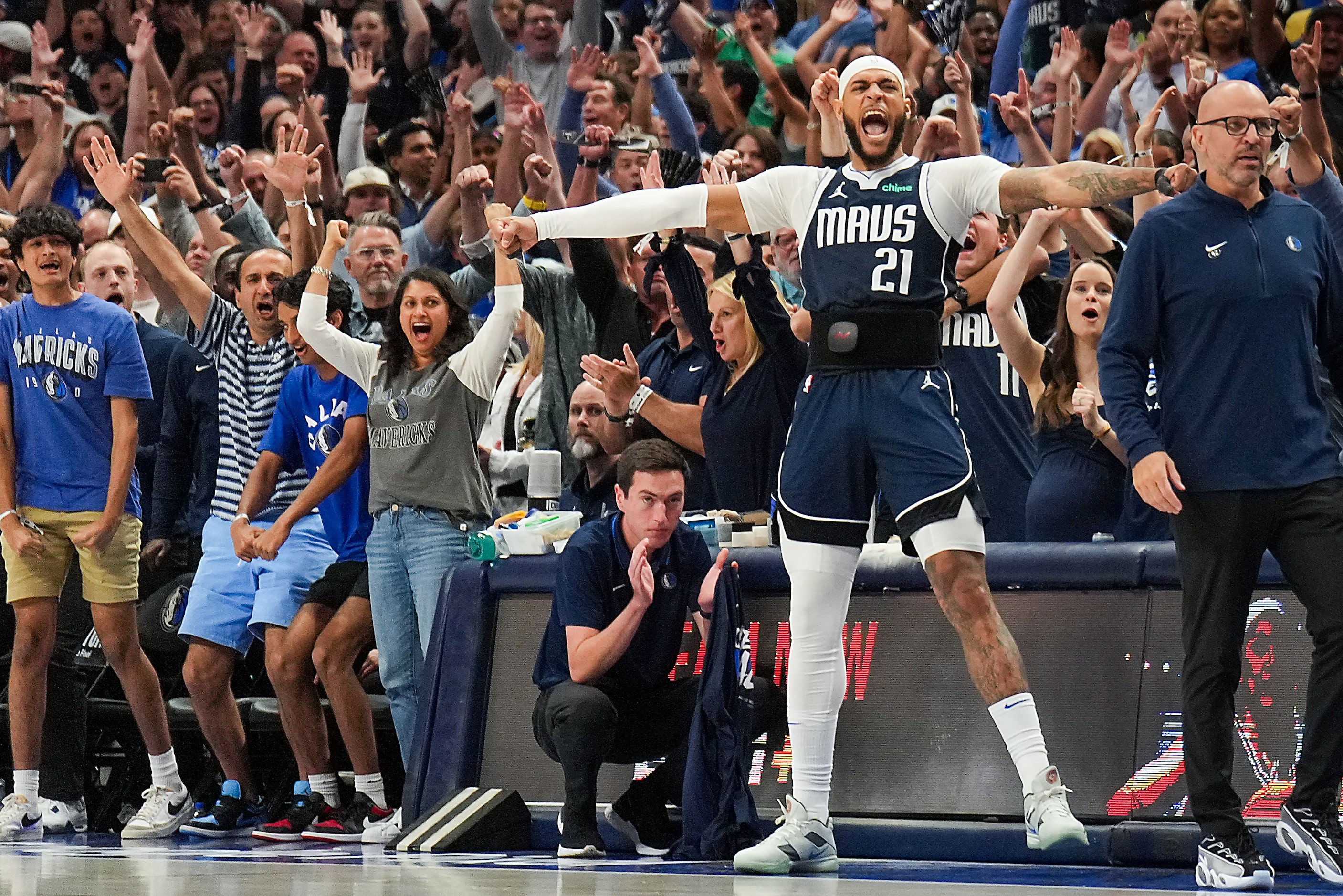 Dallas Mavericks center Daniel Gafford (21) celebrates a dunk by Dereck Lively II during the...