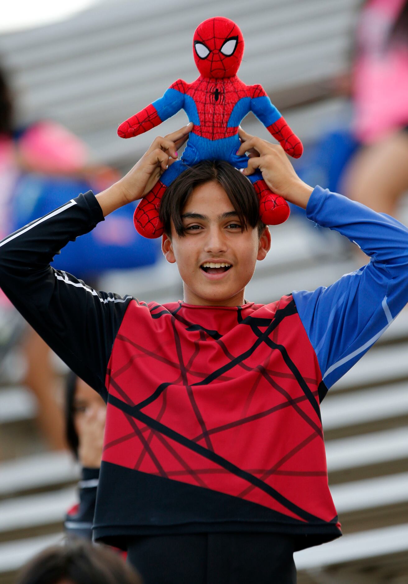 A South Garland band member sports a Spiderman outfit before the start of the first half of...